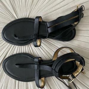 Black leather brand new Banana Republic sandals with gold buckle.